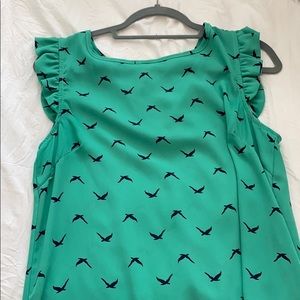 Green blouse with blue pattern